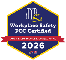 PCC Certified Workplace Safety badge 2026: blue hexagon with yellow border, helmet icon, and red ribbon inviting to learn more.